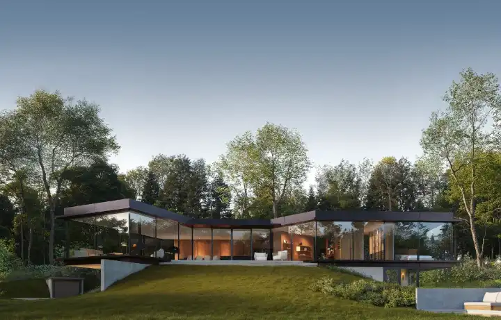 A glass-walled villa at dusk, lit from within, set against woodland