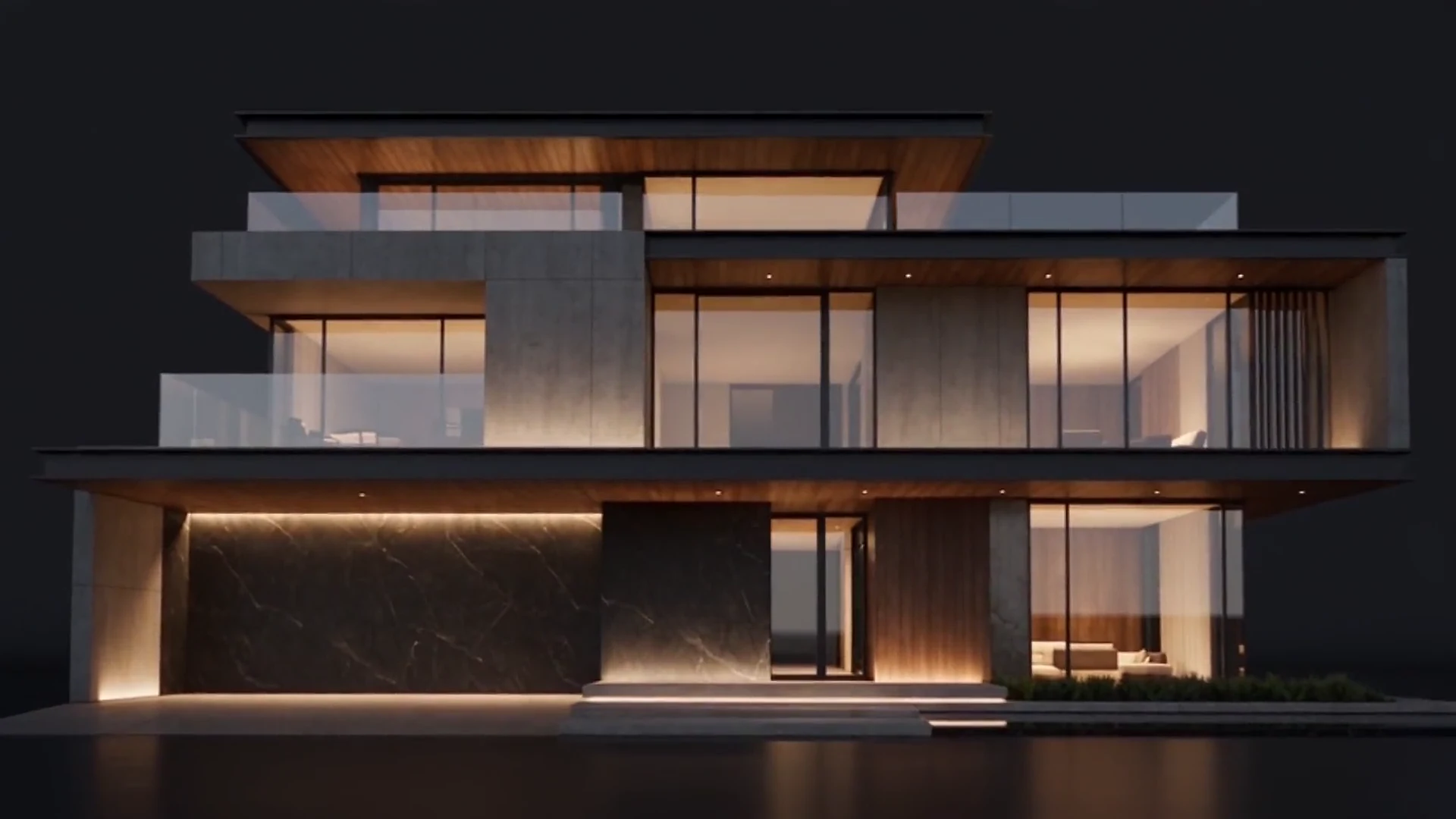 A modern villa lit up at night